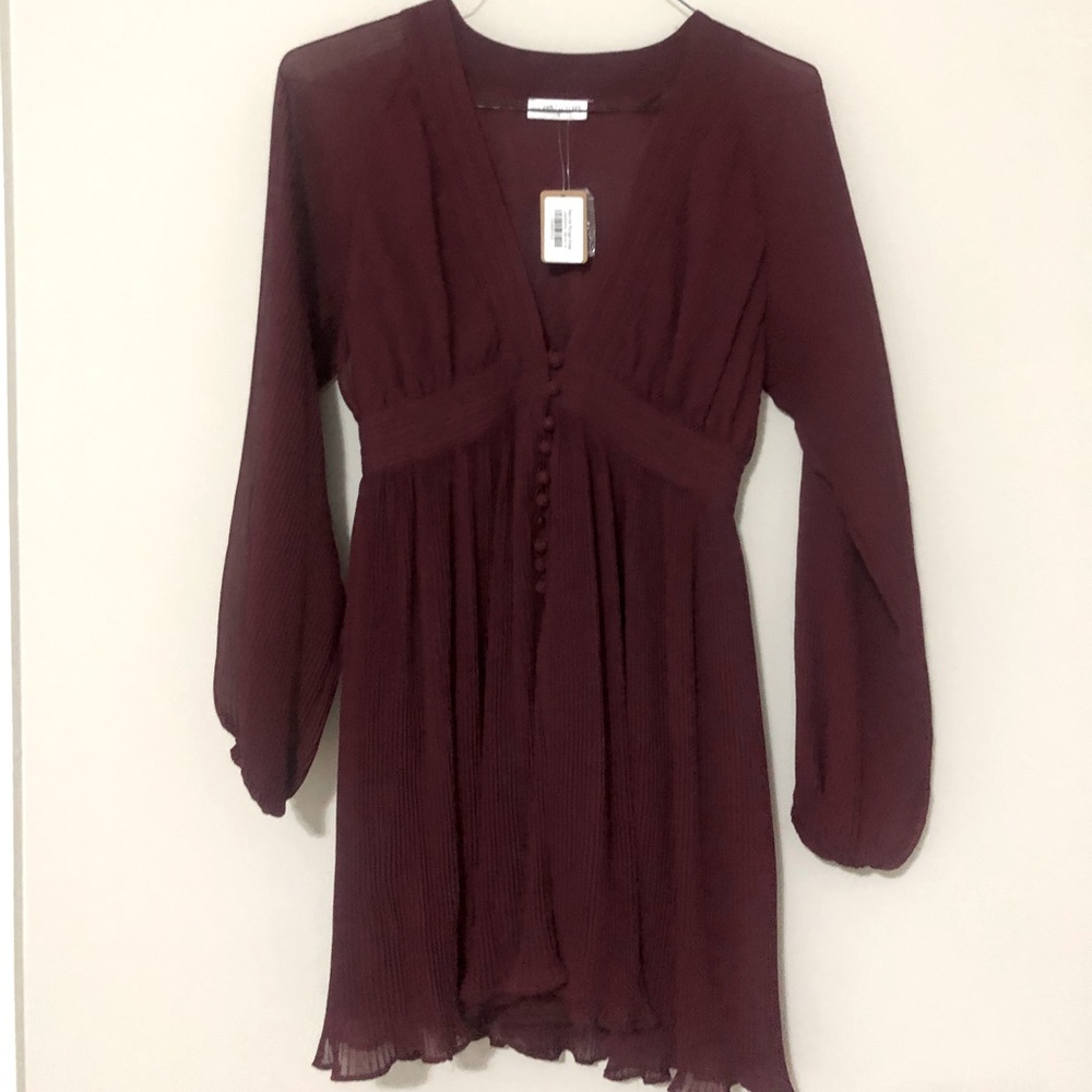 Wine colored plunge dress. Size small.